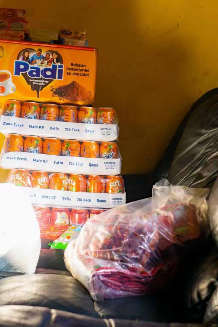 Cartons of drinks and supplies stacked ready to hand out