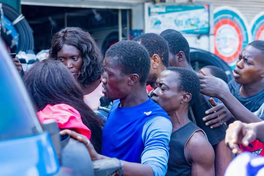 People gather for a meal during a street outreach